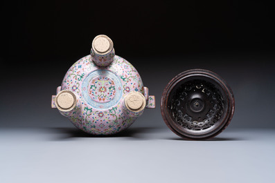 An impressive Chinese famille rose 'Bajixiang and Lotus Scroll' tripod censer with a wooden cover, Jiaqing mark and of the period