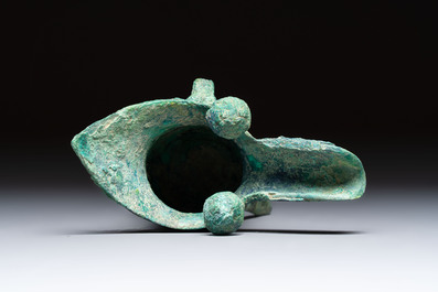 A Chinese archaic bronze wine vessel with Taotie design, Jue 爵, late Shang