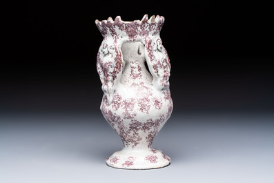 A continental manganese- and white-splashed pottery money bank, 18/19th C.