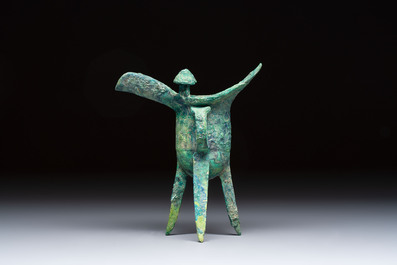 A Chinese archaic bronze wine vessel with Taotie design, Jue 爵, late Shang