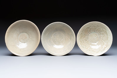 A group of nine Chinese celadon-glazed bowls with incised floral design from the Jepara shipwreck, Fujian kilns, Song