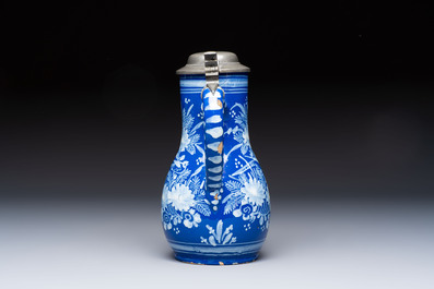 A Nevers white-decorated Persian-blue-ground faience jug with a mounted pewter lid, France, 18th C.