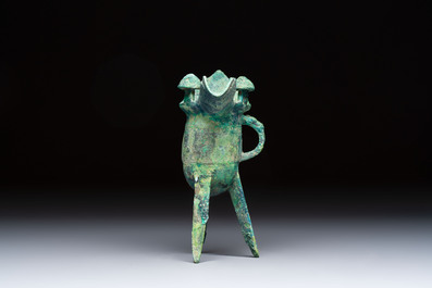 A Chinese archaic bronze wine vessel with Taotie design, Jue 爵, late Shang