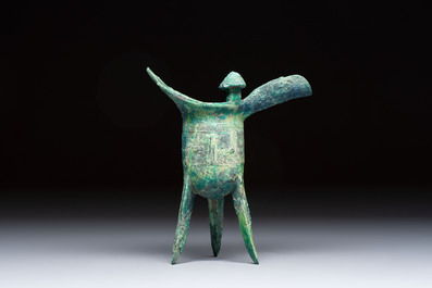 A Chinese archaic bronze wine vessel with Taotie design, Jue 爵, late Shang