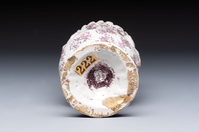 A continental manganese- and white-splashed pottery money bank, 18/19th C.