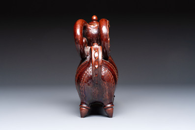 A brown-glazed stoneware ewer and cover in the shape of a ram, impressed mark, Opishne, Ukraine, early 20th C.