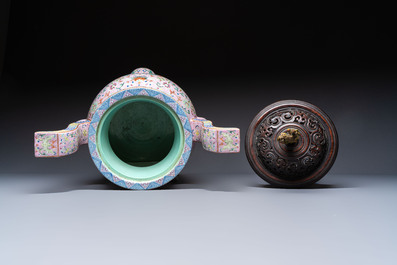 An impressive Chinese famille rose 'Bajixiang and Lotus Scroll' tripod censer with a wooden cover, Jiaqing mark and of the period