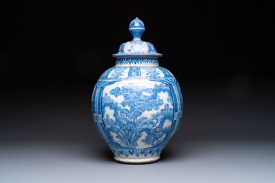 A large blue and white Dutch Delft chinoiserie vase and cover, 17th C.