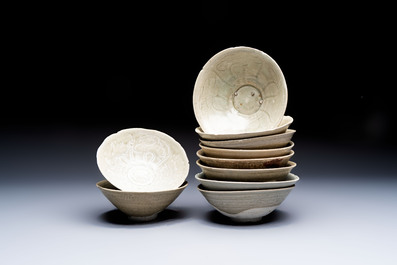 A group of ten Chinese celadon-glazed bowls with incised floral design from the Jepara shipwreck, Fujian kilns, Song