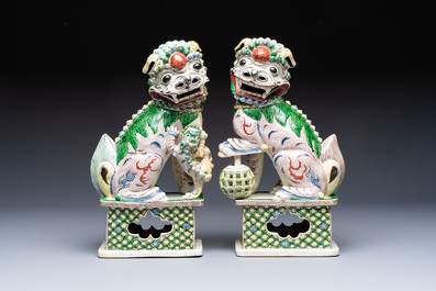 A pair of Chinese verte biscuit models of Buddhist lions, 18th C.