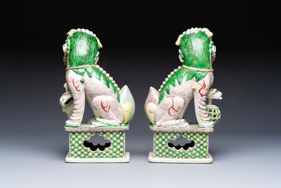 A pair of Chinese verte biscuit models of Buddhist lions, 18th C.