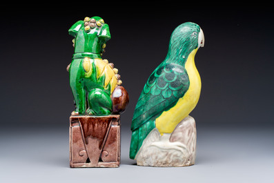 Three Chinese sancai-glazed Buddhist lions and a parrot, 19th C.