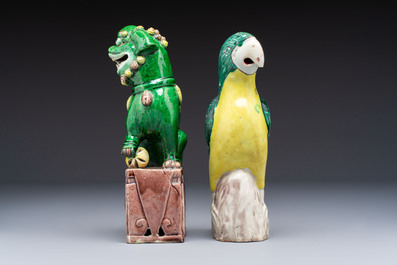 Three Chinese sancai-glazed Buddhist lions and a parrot, 19th C.