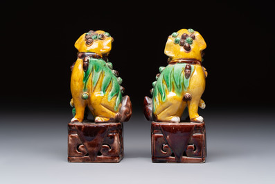 Three Chinese sancai-glazed Buddhist lions and a parrot, 19th C.