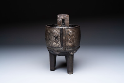 A Korean silver-inlaid iron 'He Lu Tong Chun 鶴鹿同春' tripod censer, Joseon, 18th C.