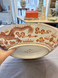 A Chinese gilt iron-red 'dragons and clouds' dish, Guangxu mark, 20th C.