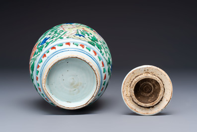 A Chinese wucai &lsquo;Buddhist Lion&rsquo; vase and cover, Transitional period