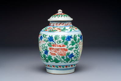 A Chinese wucai &lsquo;Buddhist Lion&rsquo; vase and cover, Transitional period