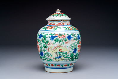 A Chinese wucai &lsquo;Buddhist Lion&rsquo; vase and cover, Transitional period