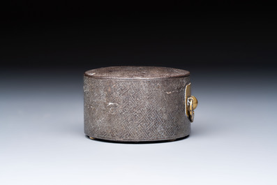 A Korean silver-inlaid iron tripod box with a gilt-bronze bat-shaped handle, Joseon, 18th C.