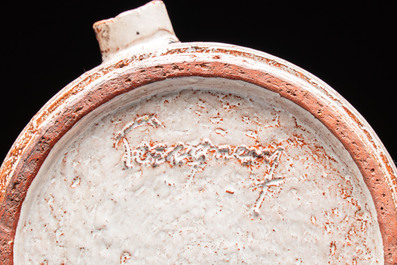 Rogier Vandeweghe (1923-2020) for Amphora: a red-glazed ashtray, and a Perignem cream-glazed ashtray, 20th C.