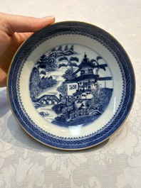 A set of 12 Chinese blue and white 'Landscape' bowls and saucers, Qianlong/Jiaqing