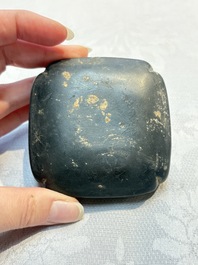 A Chinese carved black pottery 'Mythical Animal' box and cover, Yuan/Ming