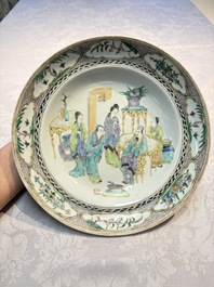 A pair of Chinese Canton famille verte plates with figural design, 19th C.