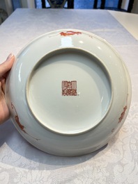 A pair of Chinese famille rose coral-ground 'Playing Boys' plates, Jiaqing marks, Republic