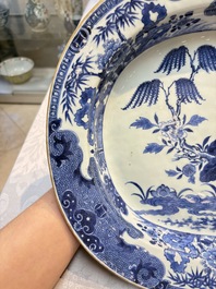 Two Chinese blue and white chargers with floral and landscape design, Qianlong