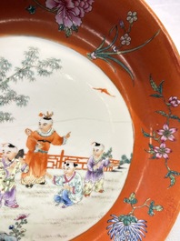 A pair of Chinese famille rose coral-ground 'Playing Boys' plates, Jiaqing marks, Republic