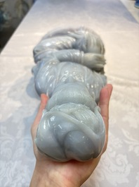 An exceptional and large Chinese carved pale lavender jadeite Guanyin on a wooden stand, Republic