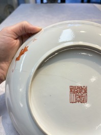 A pair of Chinese famille rose coral-ground 'Playing Boys' plates, Jiaqing marks, Republic
