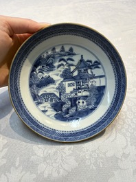 A set of 12 Chinese blue and white 'Landscape' bowls and saucers, Qianlong/Jiaqing