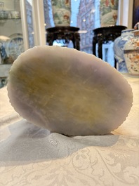 An exceptional and large Chinese carved pale lavender jadeite Guanyin on a wooden stand, Republic