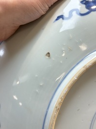 A large Chinese blue and white 'Lotus Scroll' dish, Kangxi