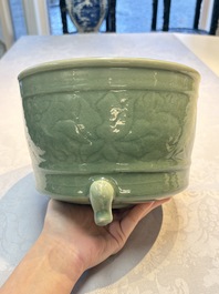 A large Chinese Longquan celadon tripod censer with floral design, Ming