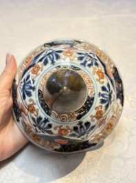 A Japanese Imari vase and cover with floral relief design, Edo, 17/18th C.