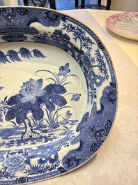 Two Chinese blue and white chargers with floral and landscape design, Qianlong