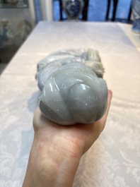 An exceptional and large Chinese carved pale lavender jadeite Guanyin on a wooden stand, Republic