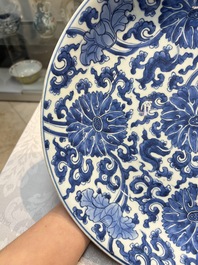 A large Chinese blue and white 'Lotus Scroll' dish, Kangxi