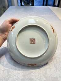 A pair of Chinese famille rose coral-ground 'Playing Boys' plates, Jiaqing marks, Republic