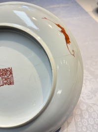 A pair of Chinese famille rose coral-ground 'Playing Boys' plates, Jiaqing marks, Republic