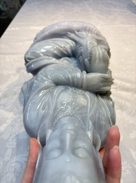 An exceptional and large Chinese carved pale lavender jadeite Guanyin on a wooden stand, Republic
