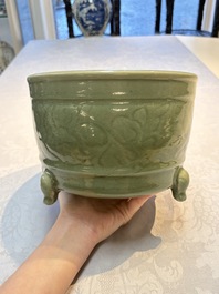 A large Chinese Longquan celadon tripod censer with floral design, Ming