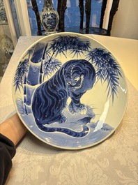 A large Japanese Arita blue and white 'Tiger' dish, Fuuki Chousun 富貴長春 mark, late Edo to early Meiji, 18/19th C.
