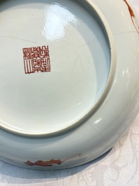 A pair of Chinese famille rose coral-ground 'Playing Boys' plates, Jiaqing marks, Republic