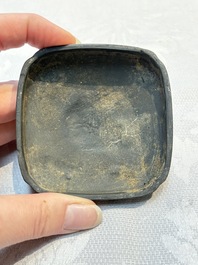 A Chinese carved black pottery 'Mythical Animal' box and cover, Yuan/Ming