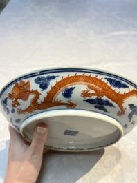 A Chinese blue and white iron-red-decorated 'Dragon' plate, Jing Jin Tang 精進堂 mark, 19th C.