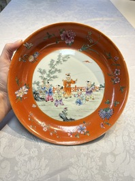 A pair of Chinese famille rose coral-ground 'Playing Boys' plates, Jiaqing marks, Republic